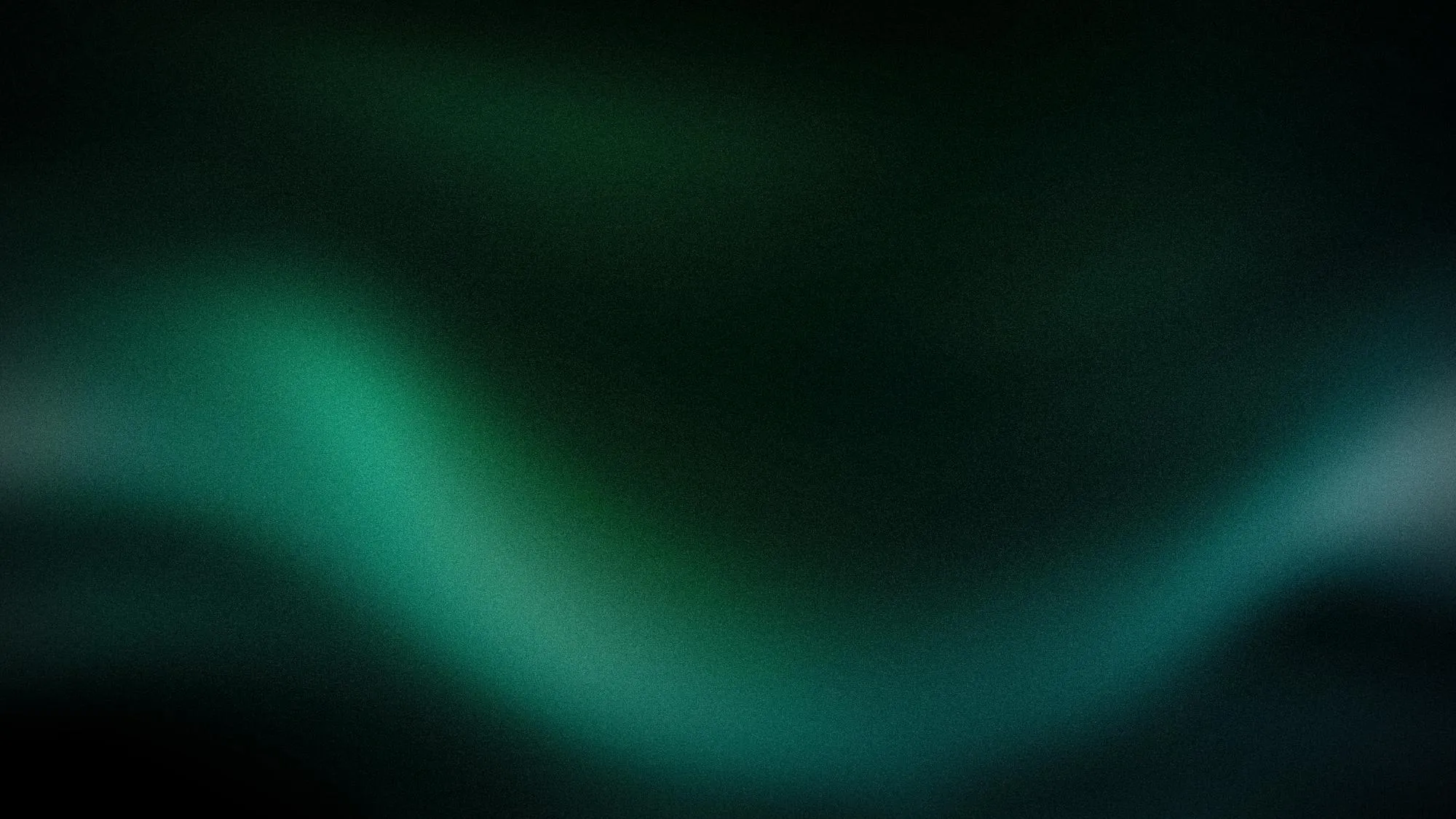 Sumuinen, vihreä ja tumma tausta, jossa on epätarkkoja valoja ja varjoja.